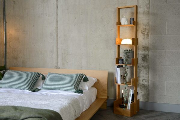 tall freestanding oak bookshelf shown with our low oak Oregon bed