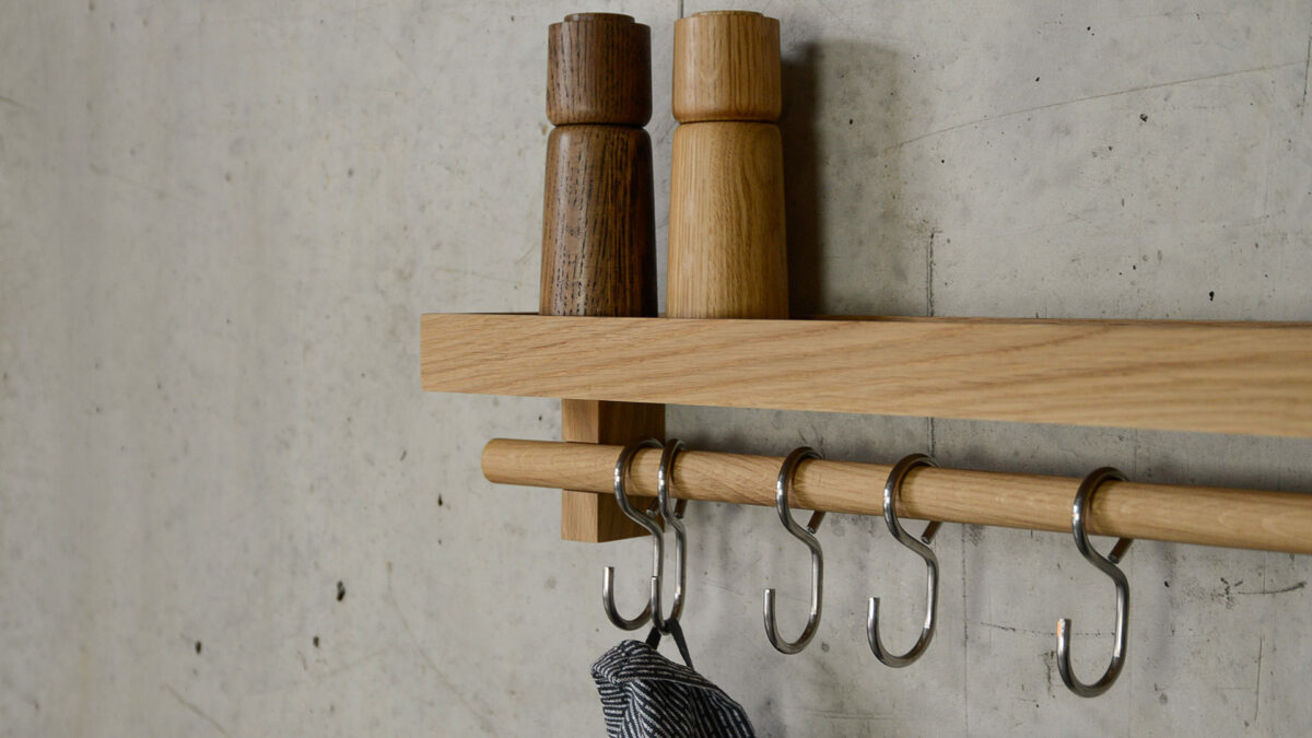 solid oak wall mounted utencil shelf with hooks