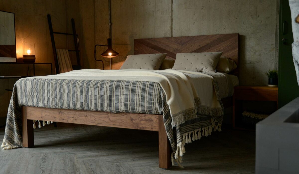 Solid wooden chunky Hathersage bed in Walnut with a chevron pattern headboard