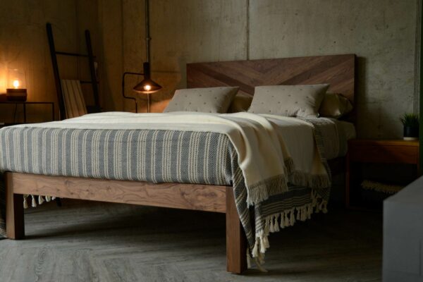 Solid wooden chunky Hathersage bed in Walnut with a chevron pattern headboard