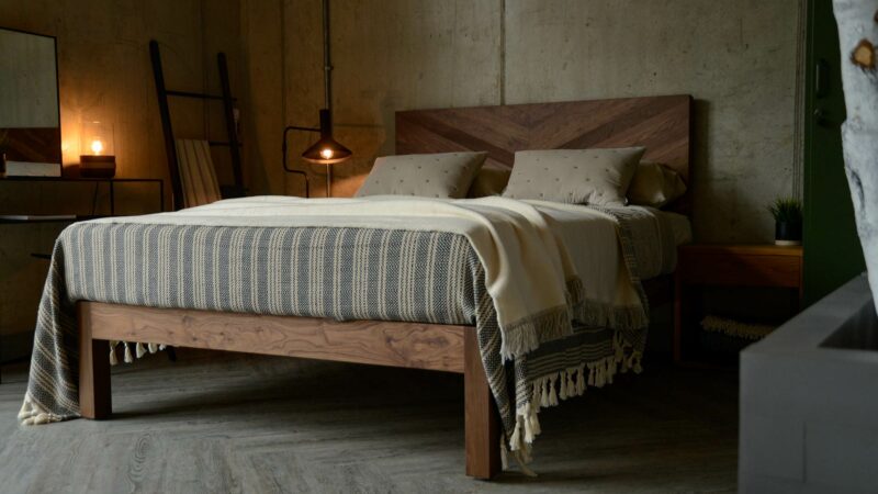 Solid wooden chunky Hathersage bed in Walnut with a chevron pattern headboard