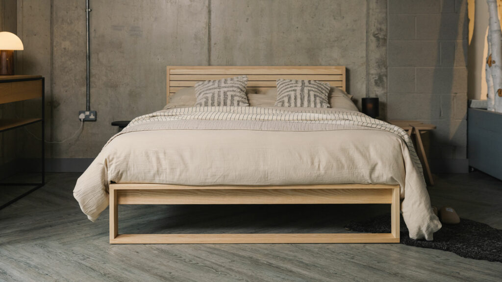 A special edition Leith bed in Ash wood with walnut stripes to the headboard panel