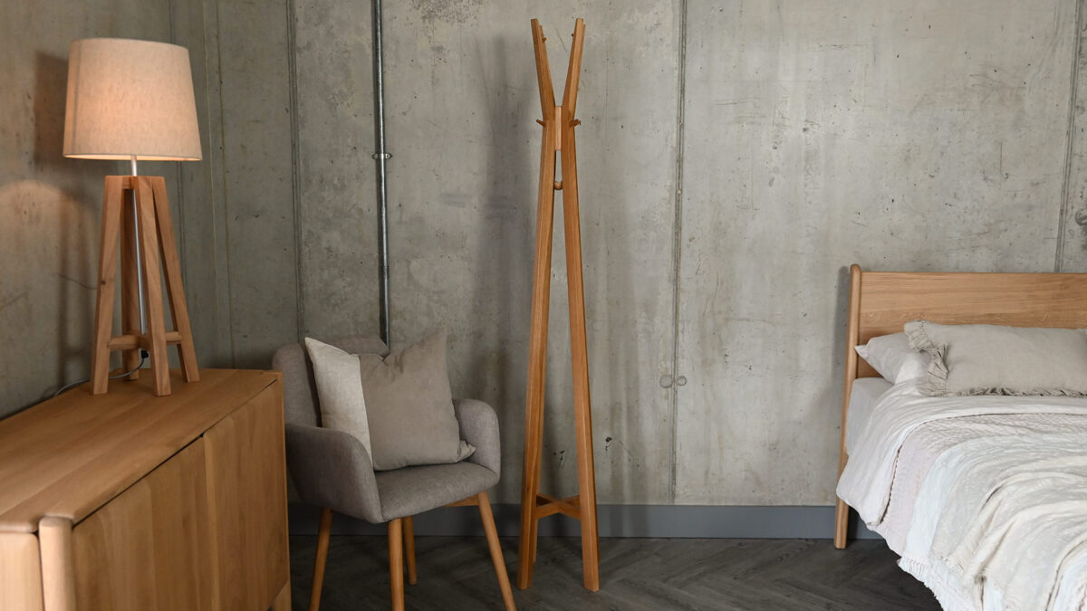 Spire coat stand stood on its own without any accessories on it, to show the full height of the item.