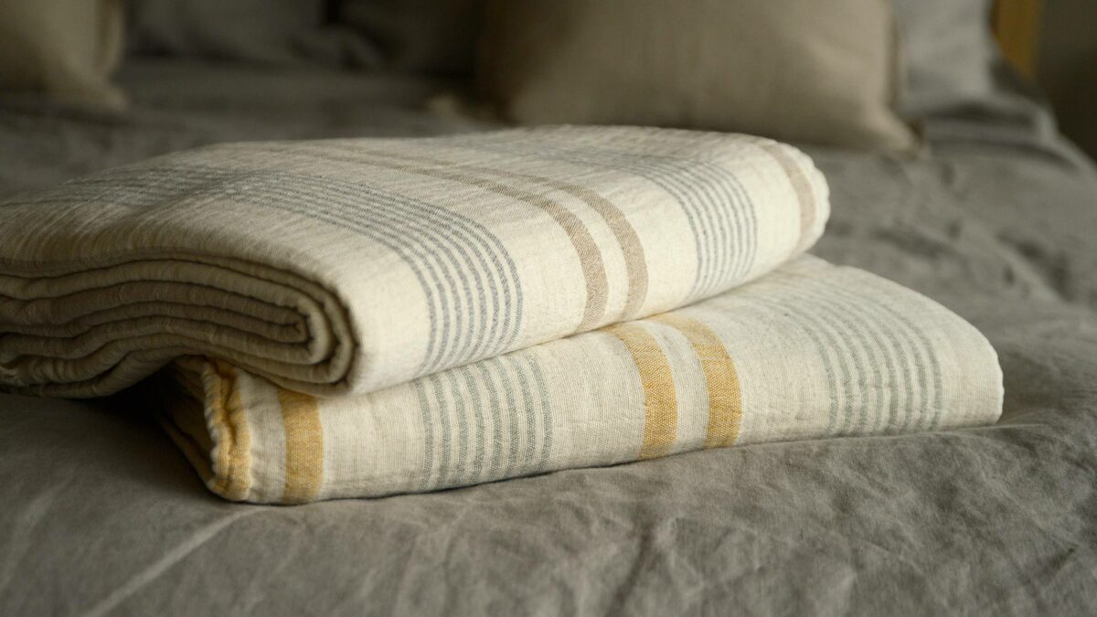 stack of cotton striped blankets picnic pattern