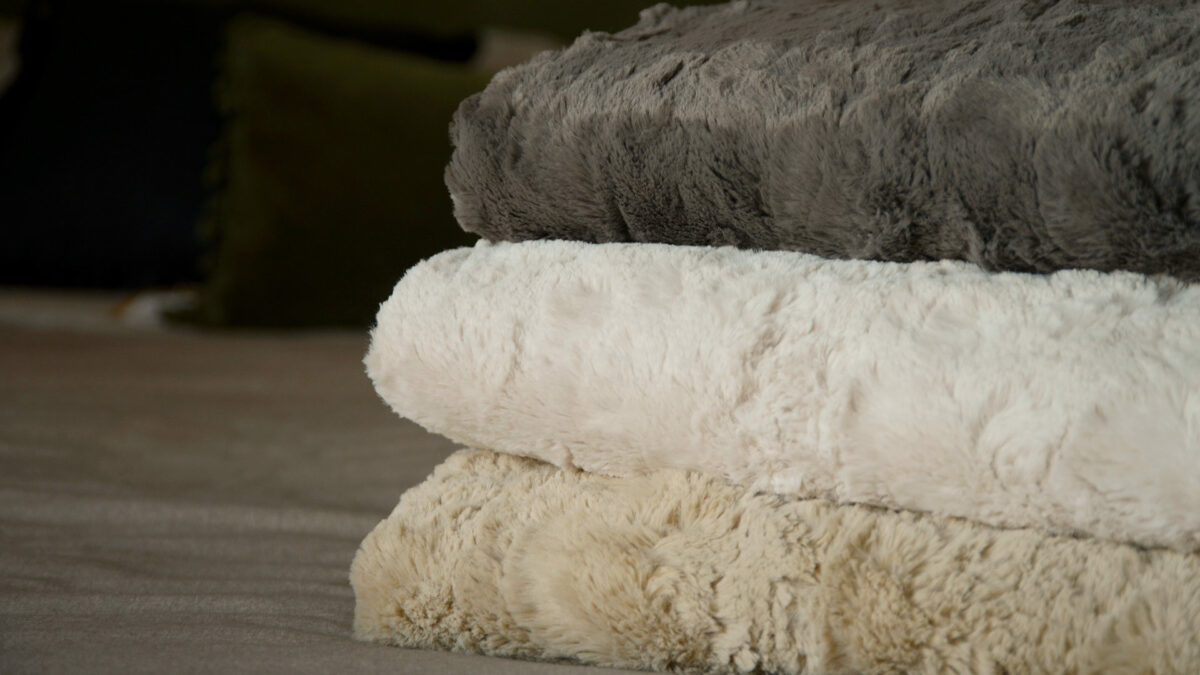 stack of faux fur throws