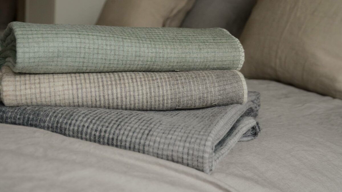 stack of gradient patterned throws