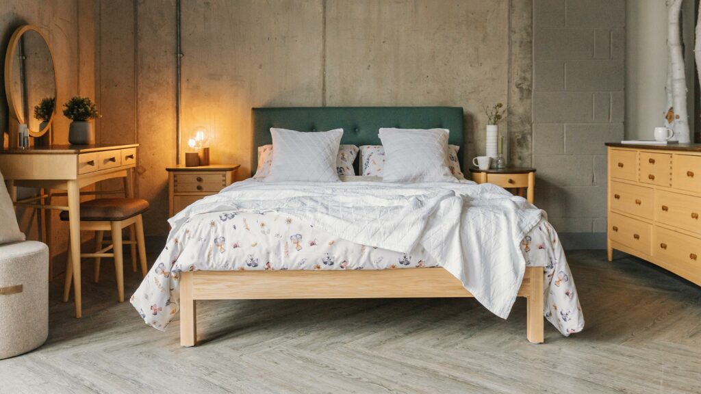 contemporary cottage bedroom style - floral bedding and crafted wooden furniture