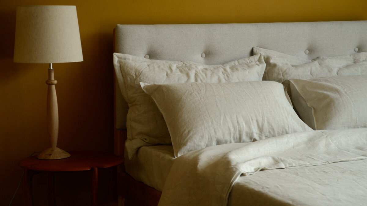 stone marl coloured linen bedding including duvet cover and pillowcases shown on a kingsize bed