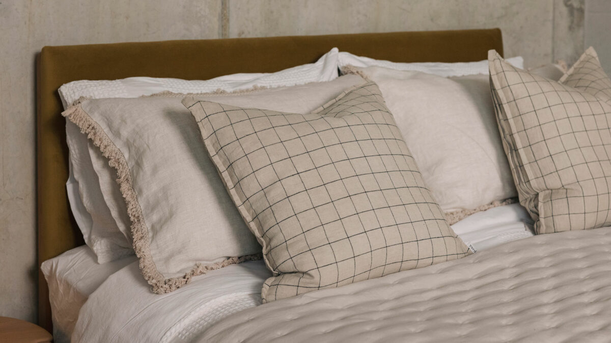 stone cushion with black windowpane pattern