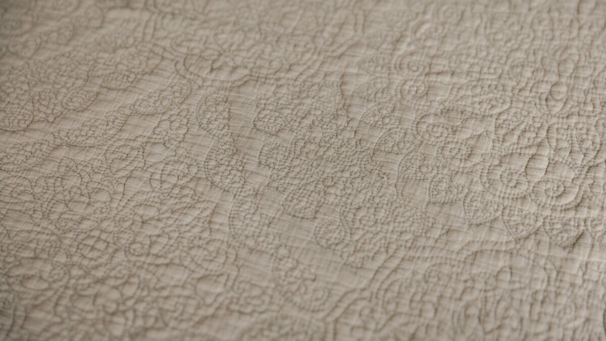 stone embroidered bedspread detail