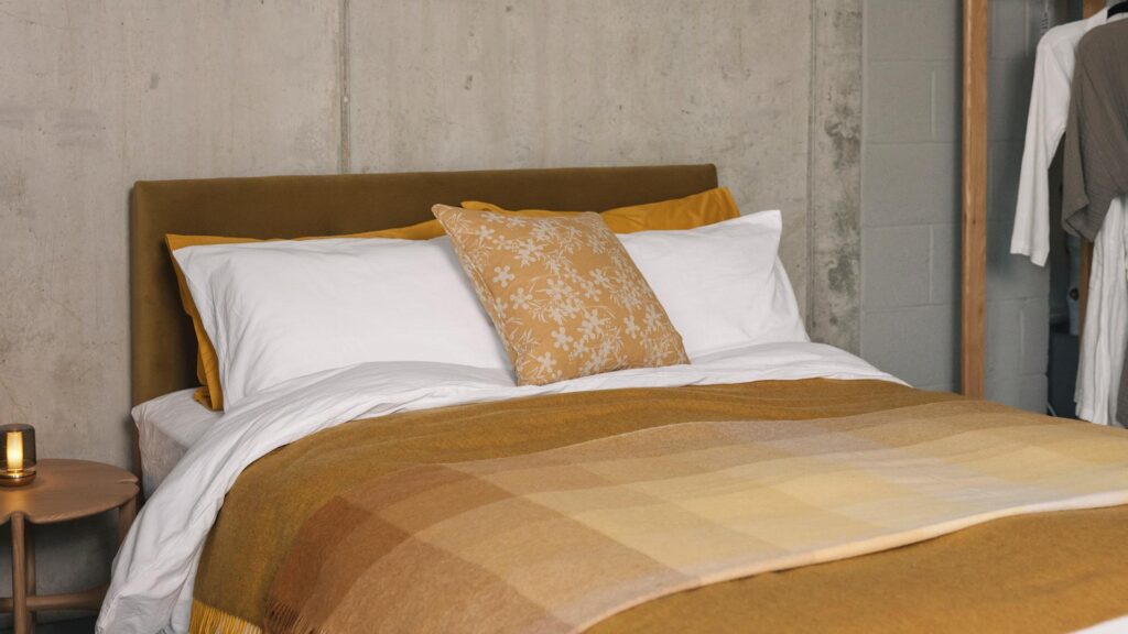 stonewash cotton bedding in white with ochre accessories