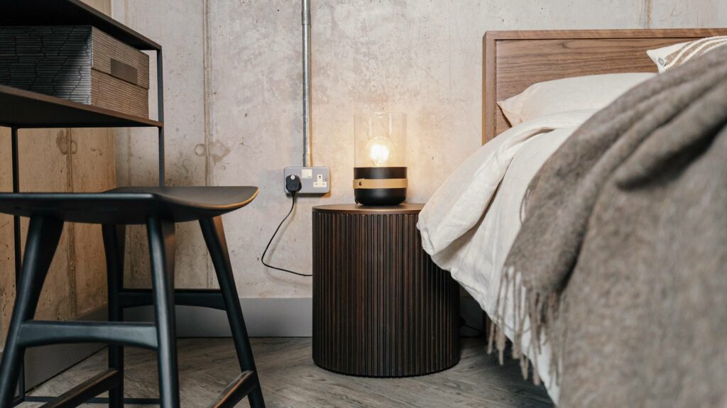 strap lamp on ethnicraft bedside storage table