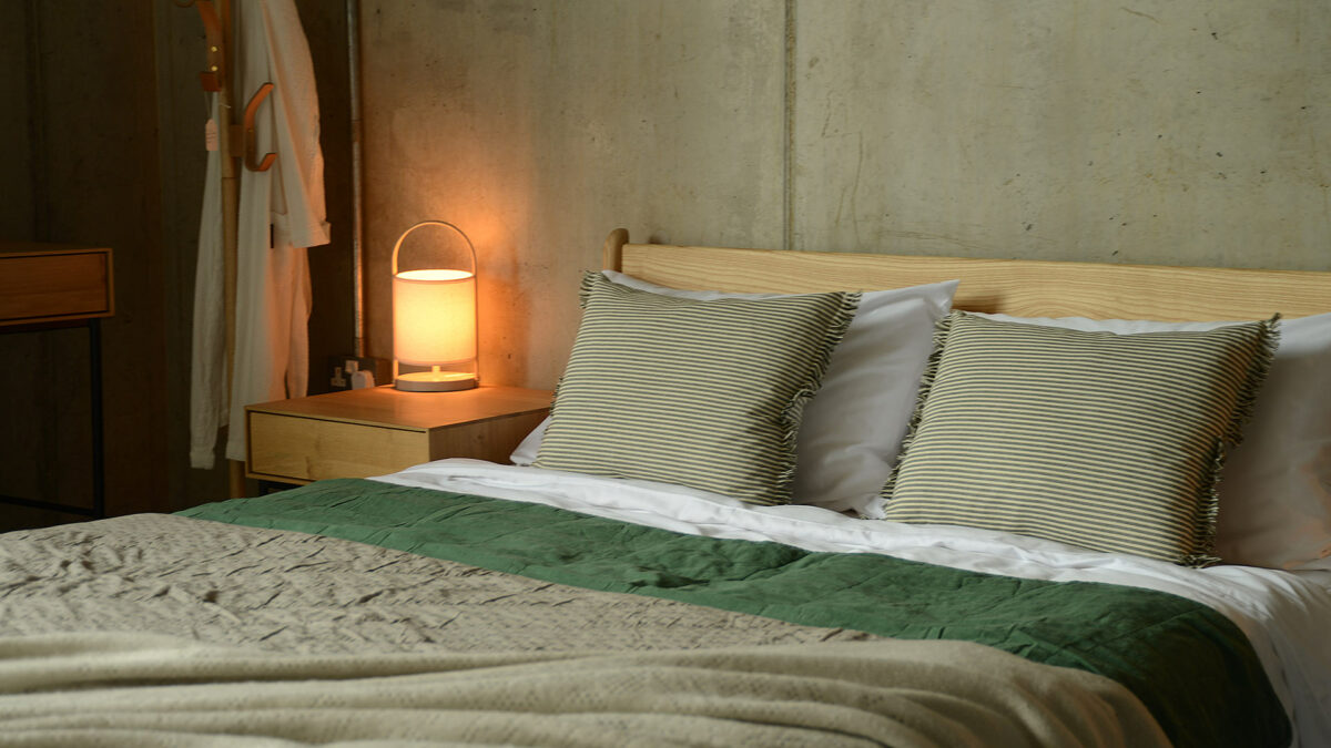 subtle green bedding and cushions