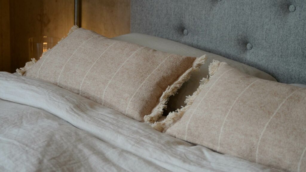 soft touch fringed rectangular cushions in clay pink and cream