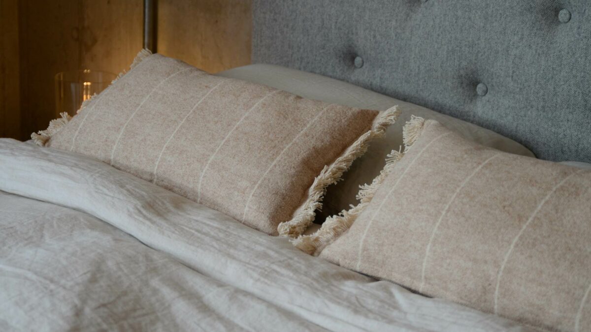 soft touch fringed rectangular cushions in clay pink and cream