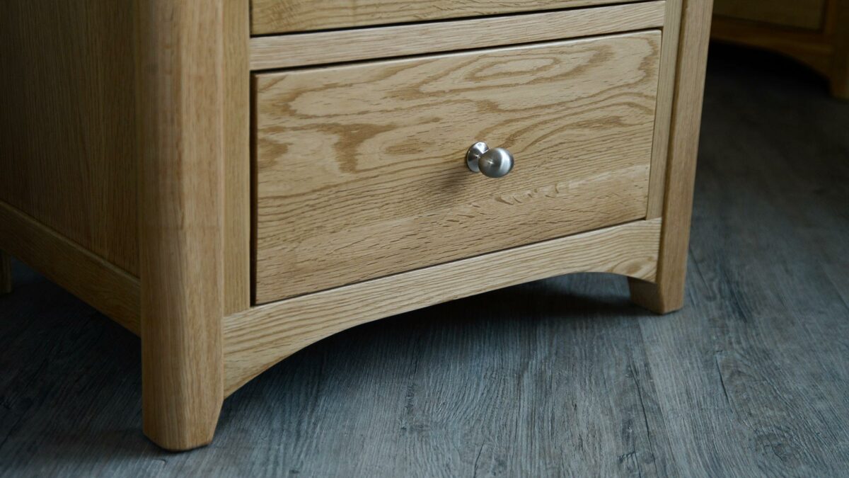 classic oak tallboy chest of drawers a close up of the leg