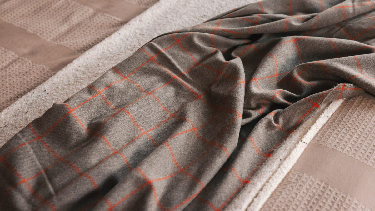 taupe cashmere throw with orange windowpane design