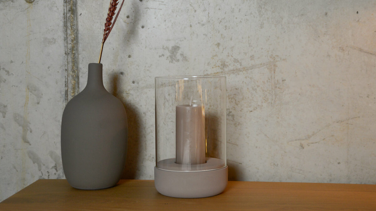 candle holder with a taupe concrete base