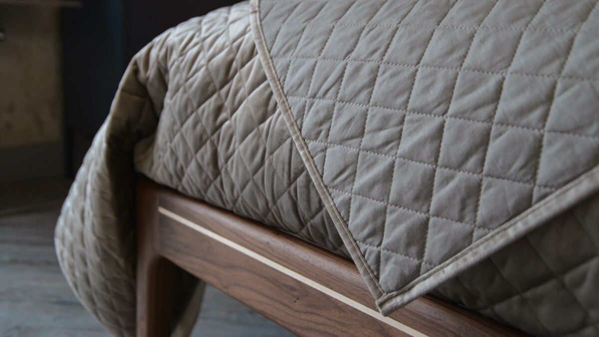 Taupe coloured velvet-look quilted and reversible bedspread a closer view