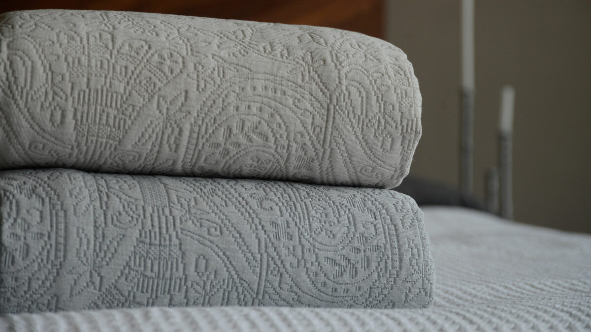 textured bedspreads with paisley style pattern