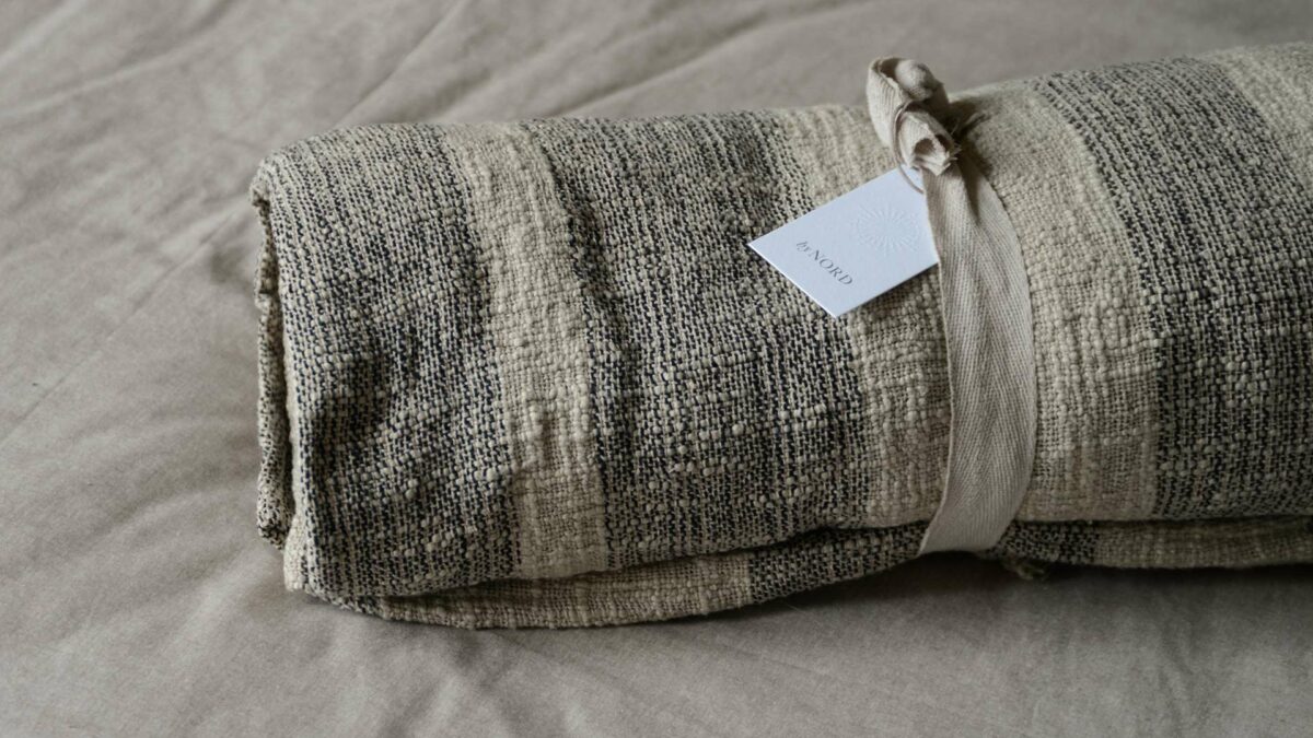 textured cotton bedspread with black stripes