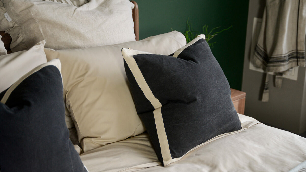 black cotton cushions with ivory coloured edges