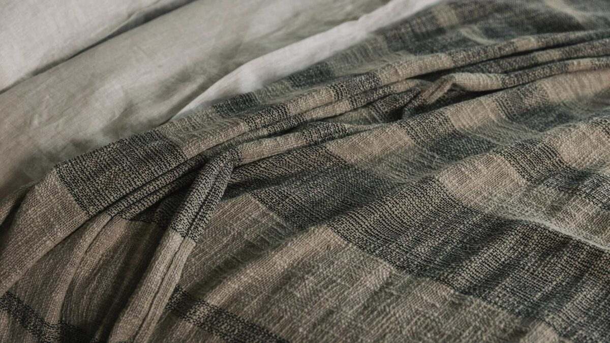 luxurious textured weave bedspread with stripes of taupe and black threads