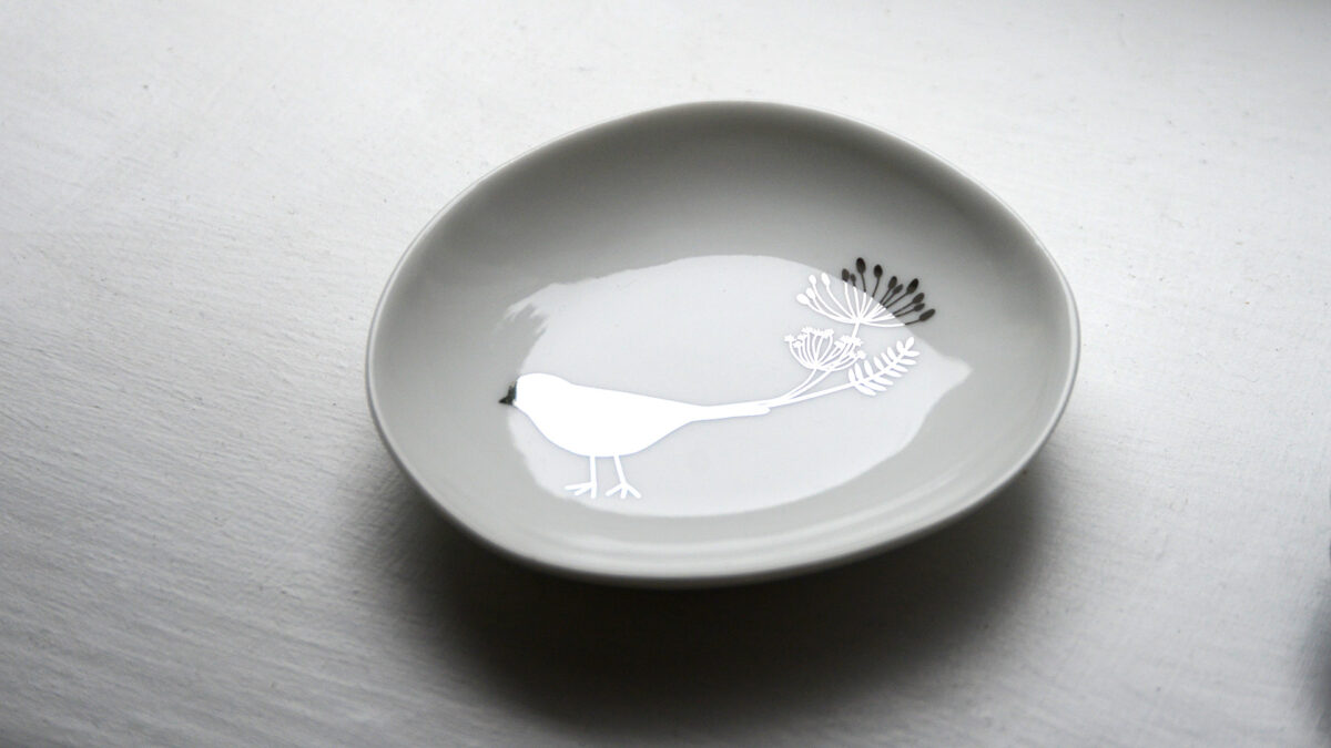tiny dish with silver bird motif