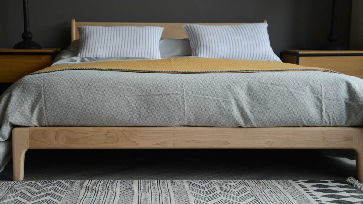 silver grey bedding on pale wooden Pimlico bed