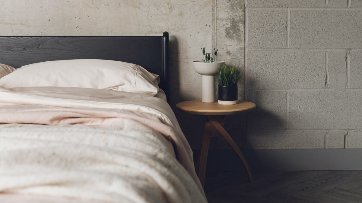 Blush pink bedding used with a black painted Pimlico low bed