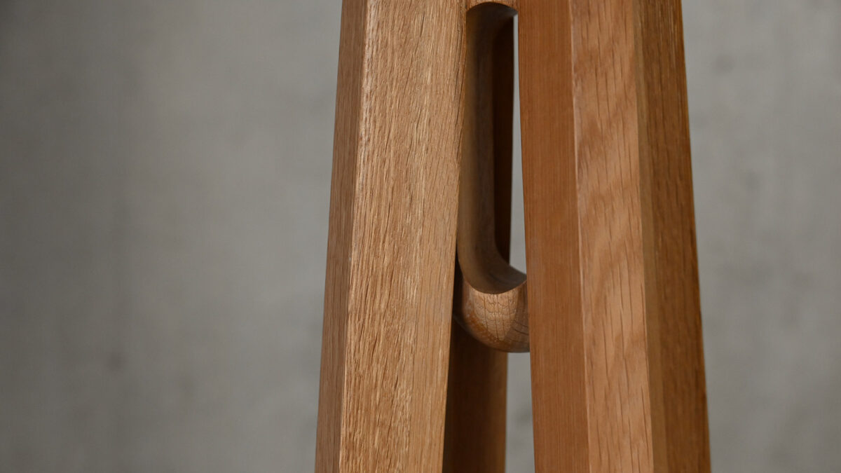 Closeup detail of umbrella hook on Spire Coat Rack.