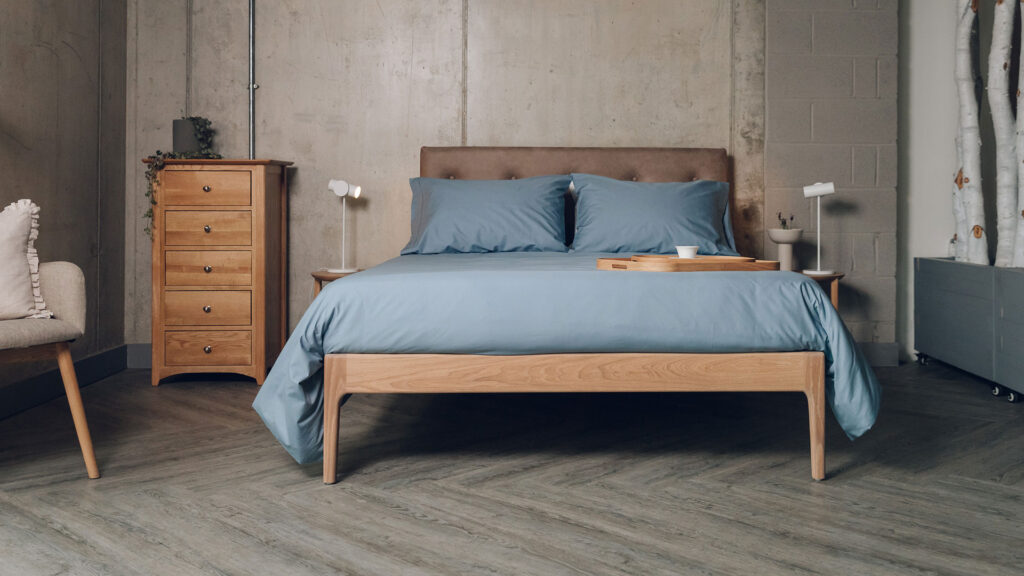 vaquero and oiled oak bloomsbury bed with storm blue bedding