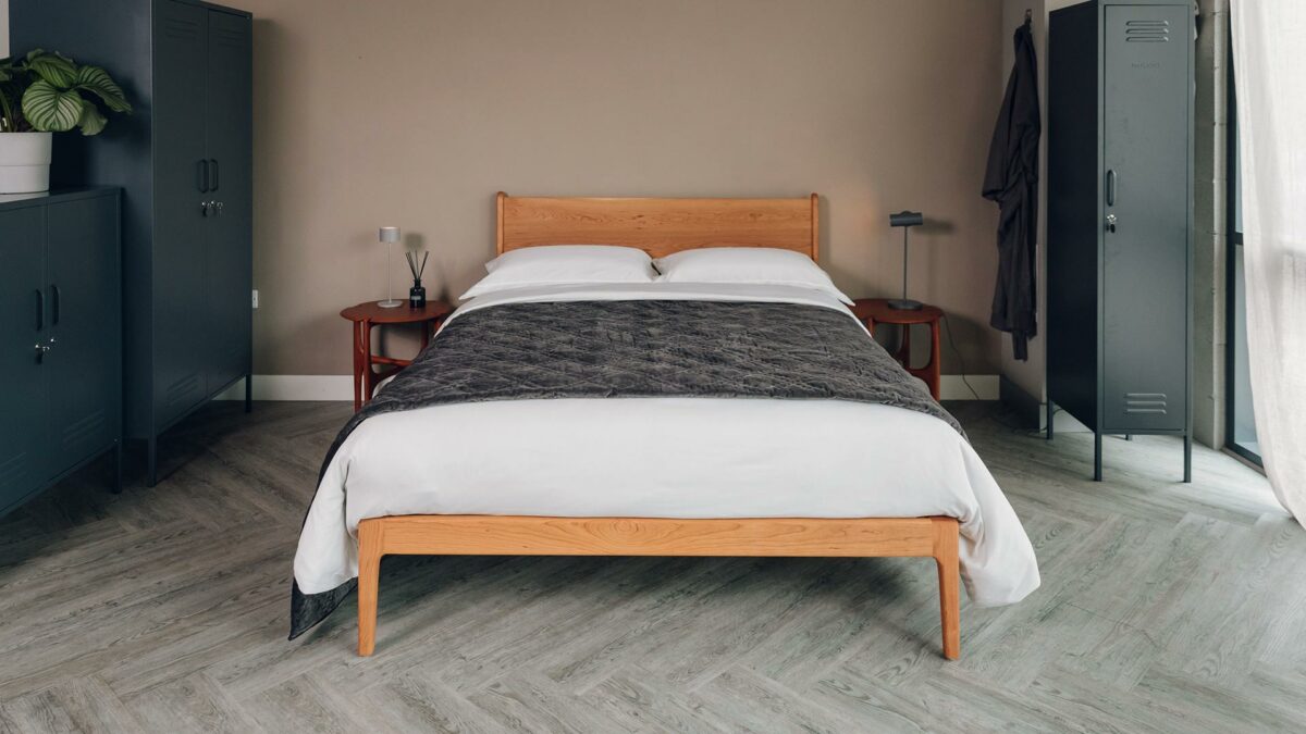 pale grey and ivory thin stripe duvet cover set shown on a cherry wood Camden bed