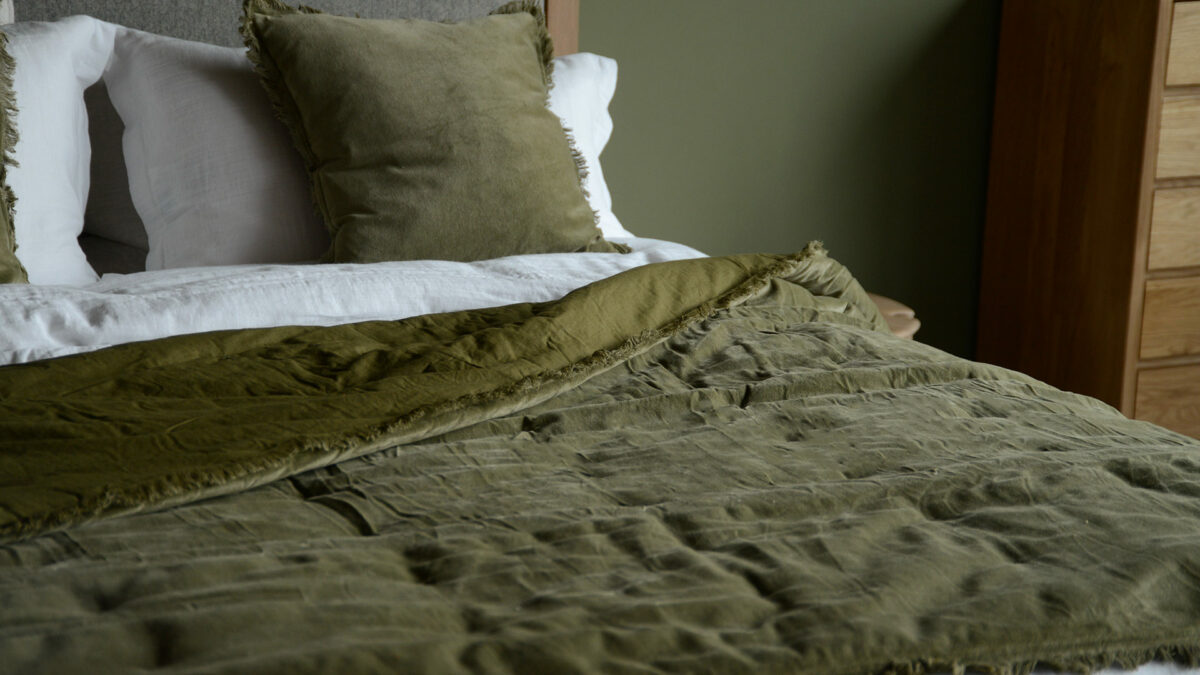 velvet cushions and throw in deep olive
