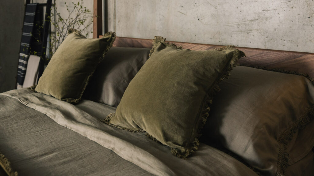 velvet cushions in olive with fringe detail