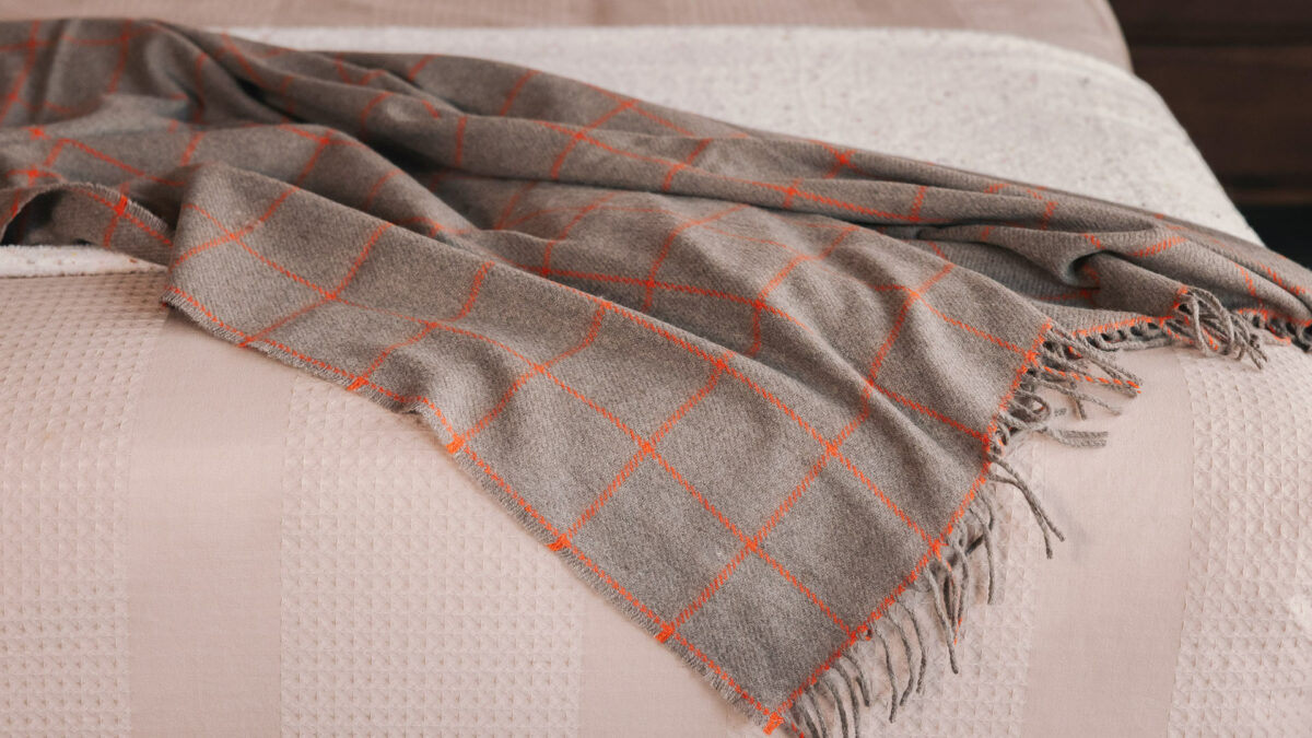 waffle stripe bedding with cashmrere throw in taupe and orange