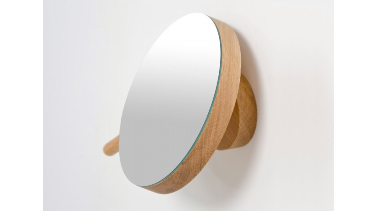 shown from the side our adjustable magnifying wall mirror with oak back and handle