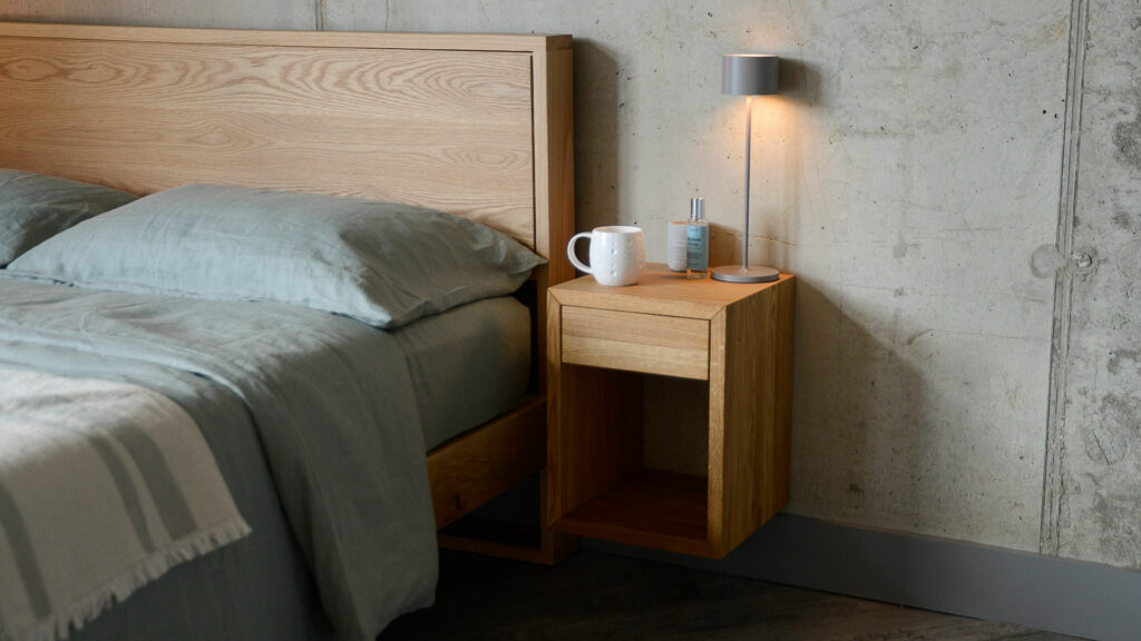 wall hung or floor standing wooden bedside table in oak