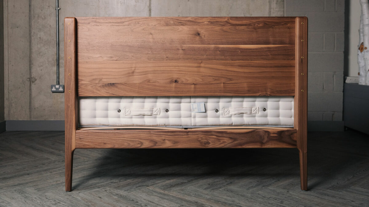 a view of the reverse of the headboard of a walnut wood Chiswick bed