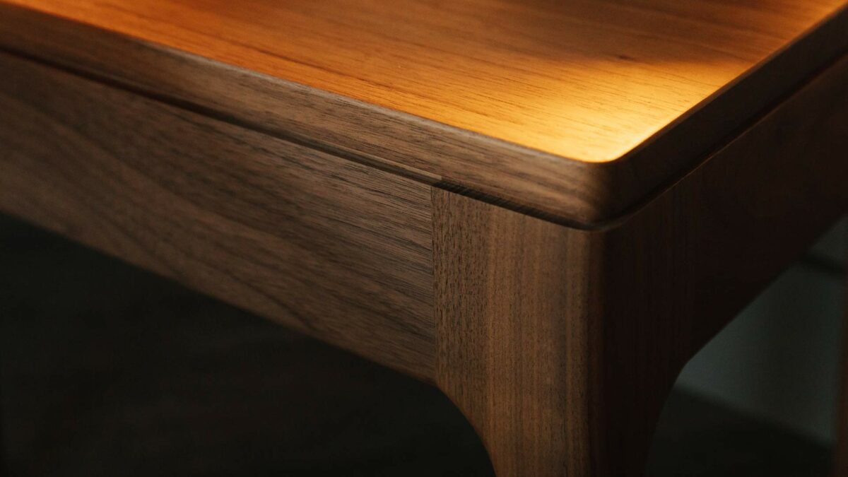 Detail view of our walnut solid wood hand made Camden table