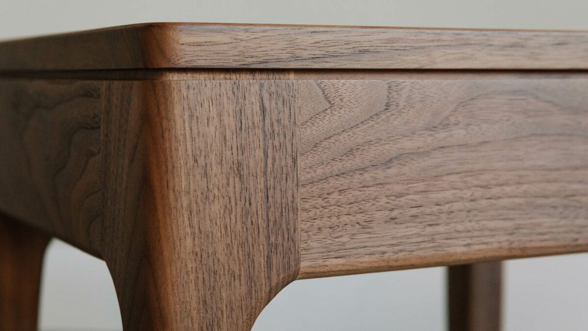 Detail view of our walnut solid wood hand made Camden table