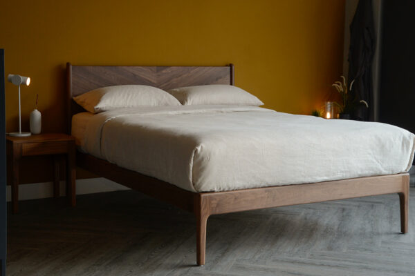 the Hoxton handcrafted solid wood bed with chevron pattern headboard here it is made in Walnut