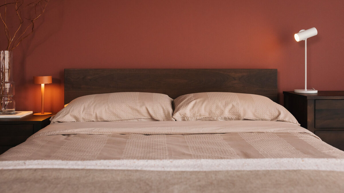 walnut Malabar bed with smoked finish waffle stripe bedding