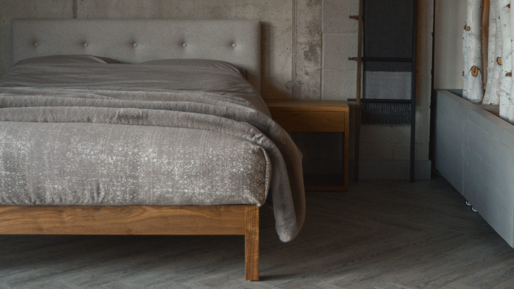 Walnut Arran bed with a buttoned upholstered headboard available in a choice of fabrics