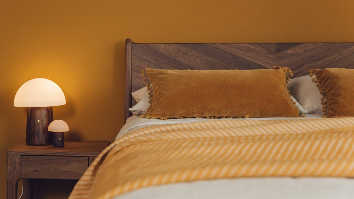 Walnut wood Hoxton bed shown with Mushroom lamps with walnut bases