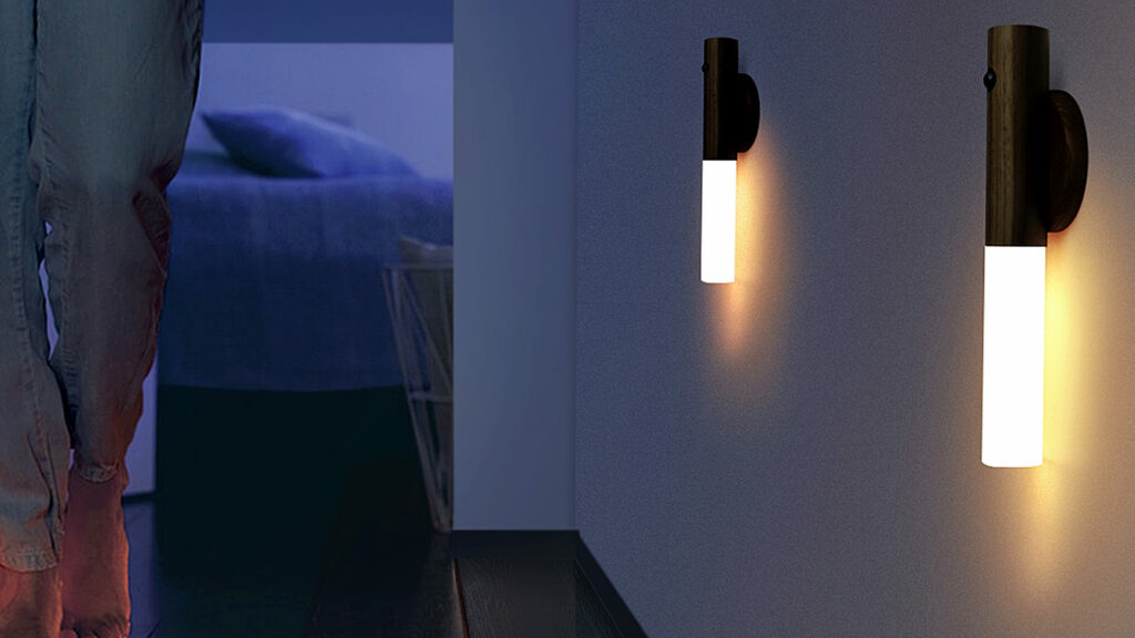 chargeable LED light with walnut base and magnetic holder shown as wall light