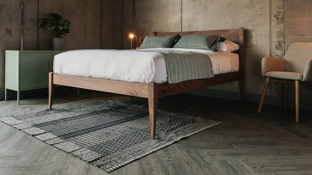 Scandi style bedroom featuring a classic solid walnut wood Dalston bed