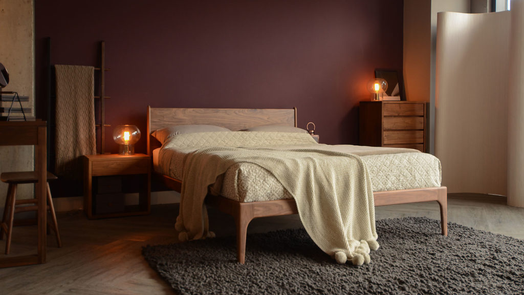 Hand made wooden Camden Bed in Walnut, with a matching walnut bedside and tall chest.