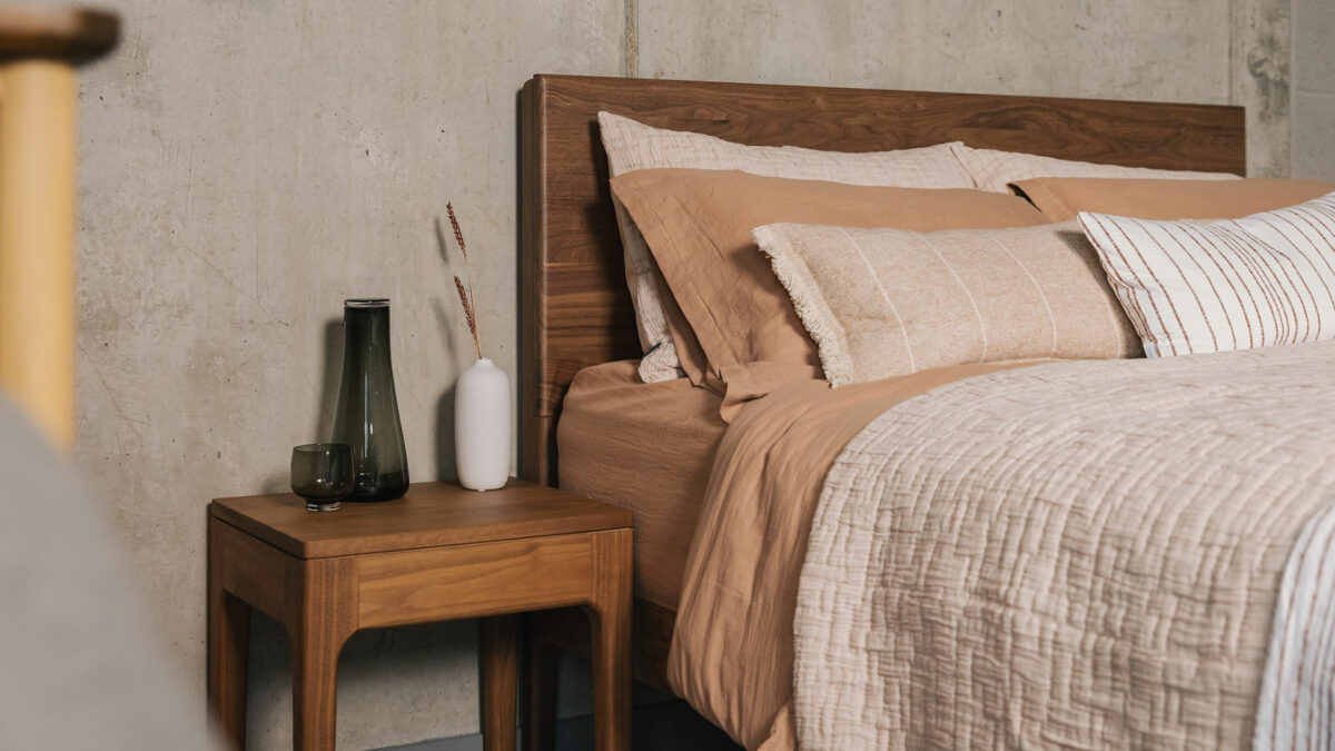 Camden bedside table in walnut shown with walnut Chiswick bed