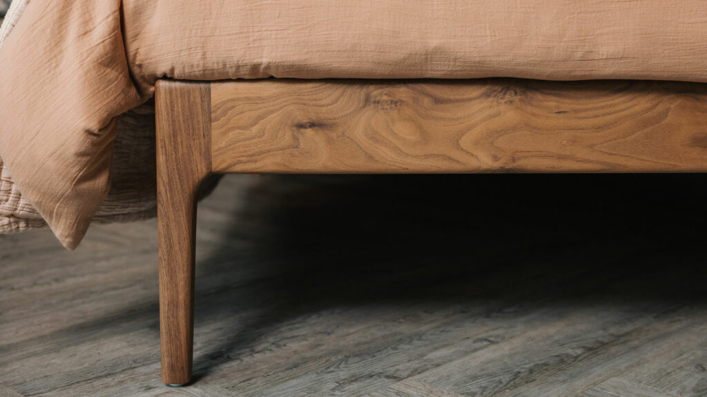 Chiswick solid wooden bed here made from walnut a close up of the foot end leg